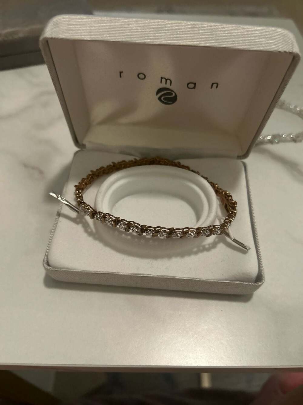 Roman Gold Tone Cubic Zirconia Tennis Bracelet with S-Curve Accents